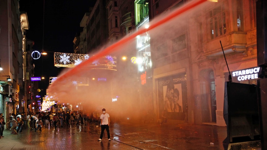 Riot police fire water cannon at protesters in Taksim Square, Istanbul.
