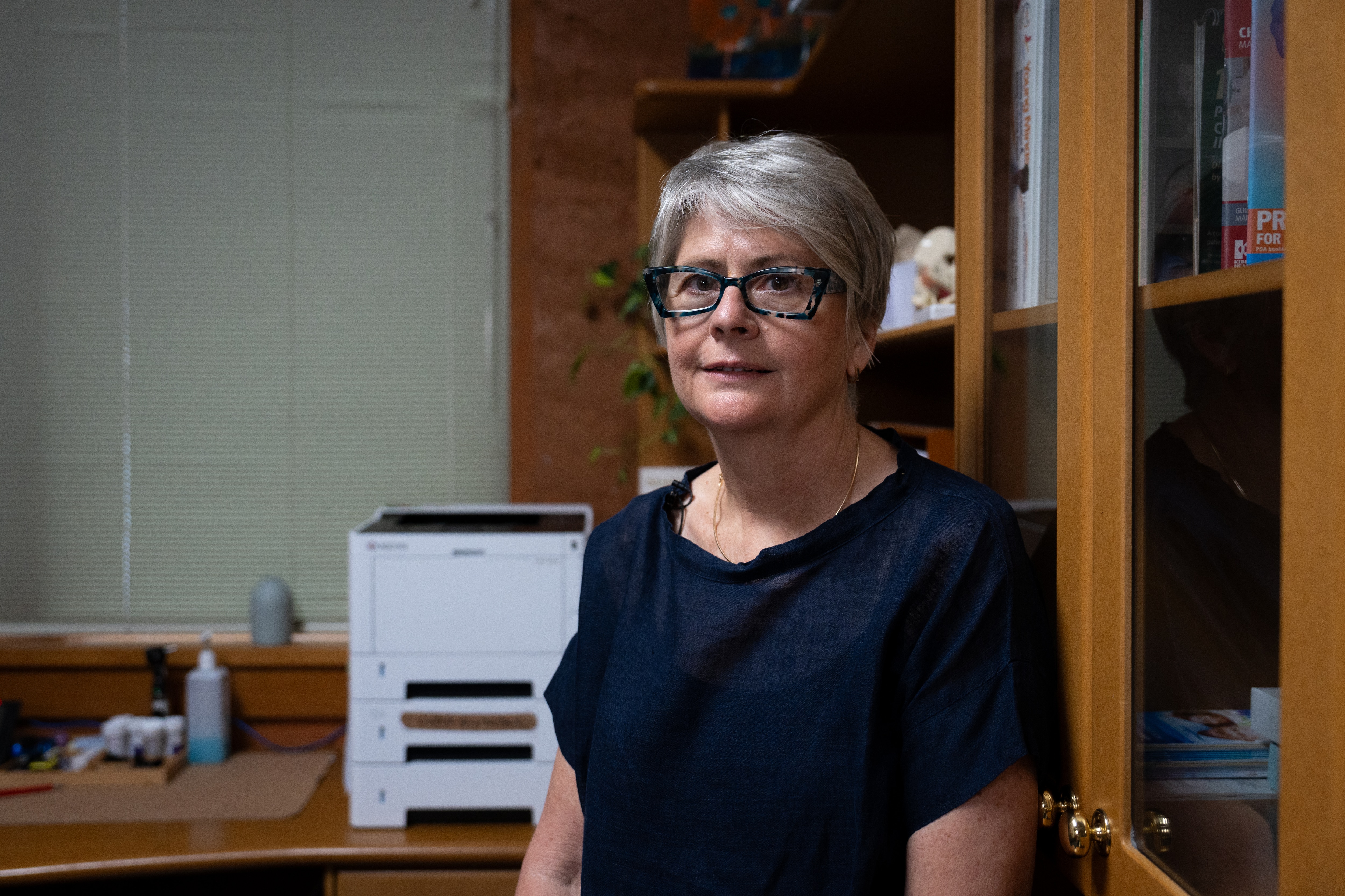 Lorri smiling in her office.