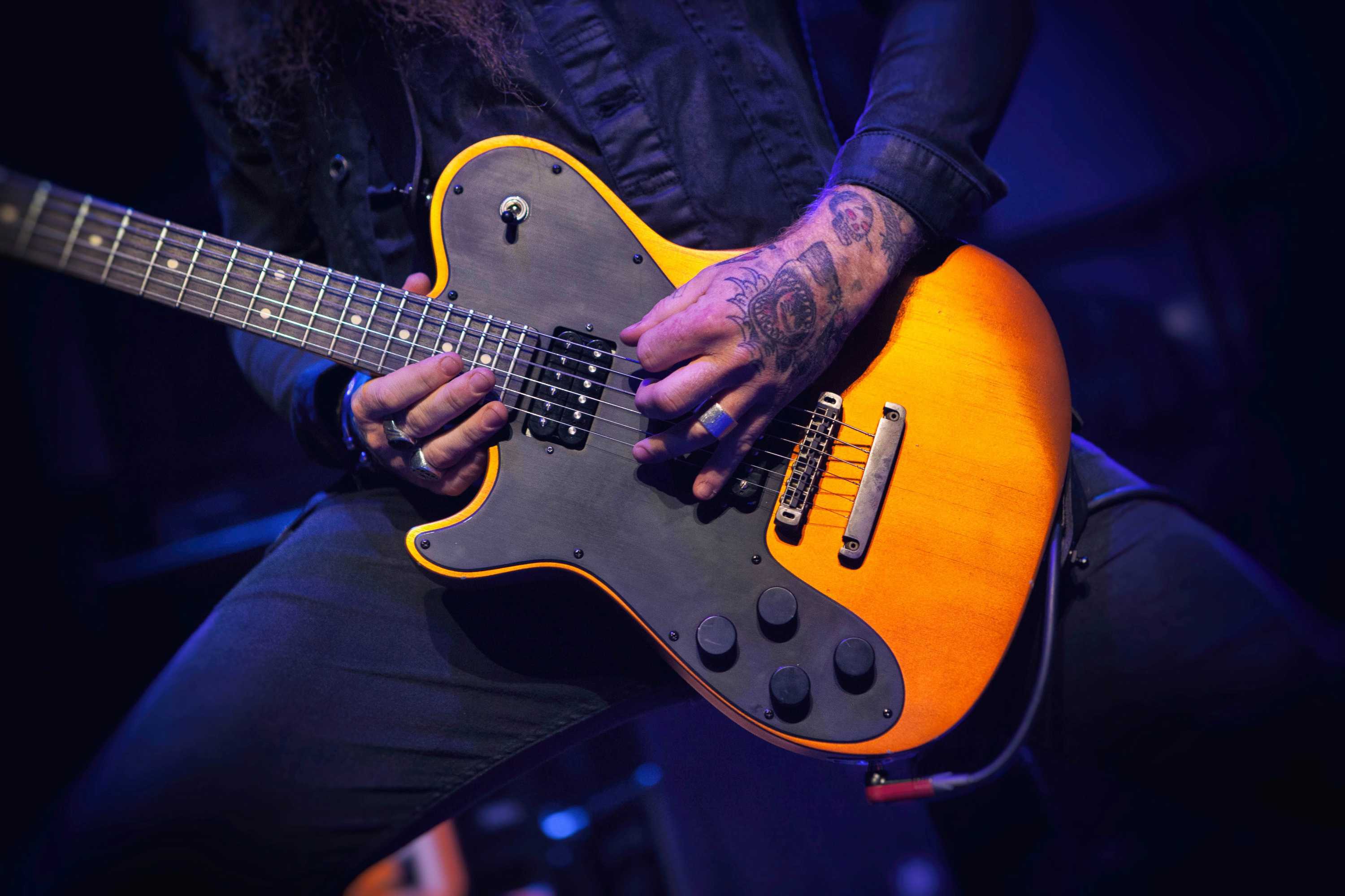 a man playing a guitar