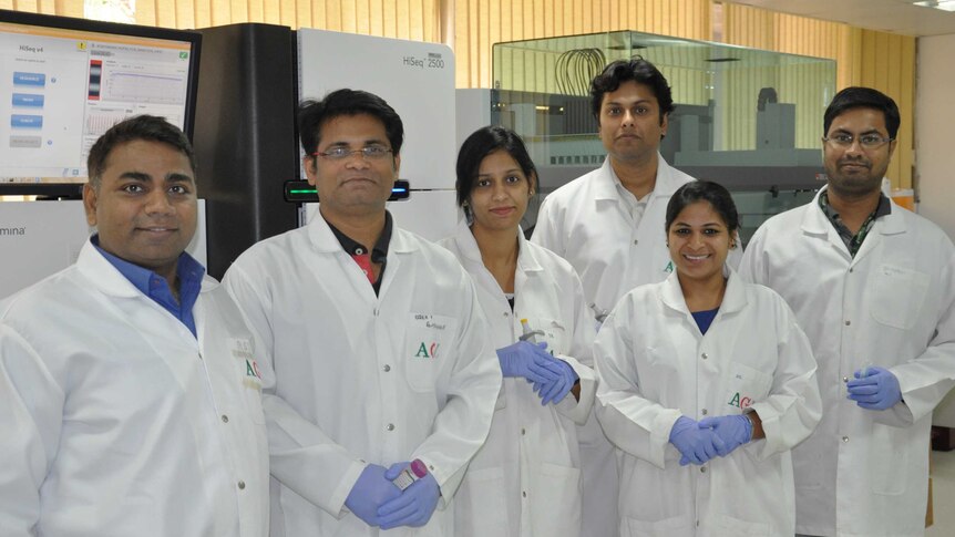 Dr Rajeev Varshney (left) Coordinator of the sequencing project with ICRISAT researchers, looking at coding peanut DNA