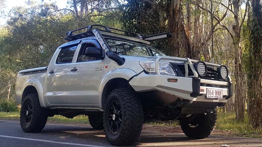 The silver-coloured Toyota Hilux dual cab owned by Bobby Cook, parked on a road beside bushland.
