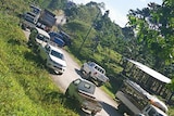 Trucks block the road and entrance to the refugees' accommodation on Manus Island