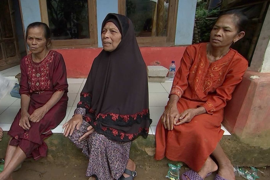 A group of women sit together.