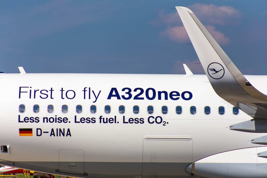 A close-up shows the rear quarter of an Airbus A320neo, with the words 'less noise. less fuel. less C02' printed on the side.