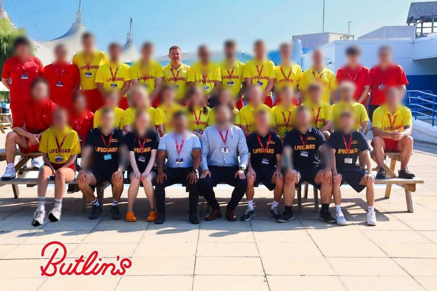 a large group of lifeguards posed for a photo