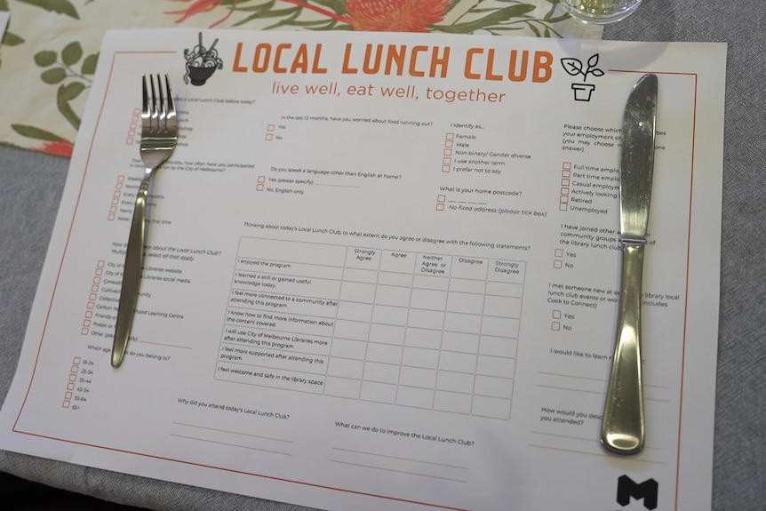 A placemat on a table featuring a questionnaire for attendees 