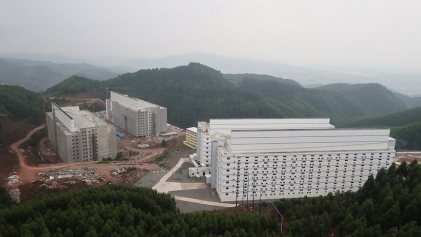 Apartment block-style pig farms in the mountains in China.