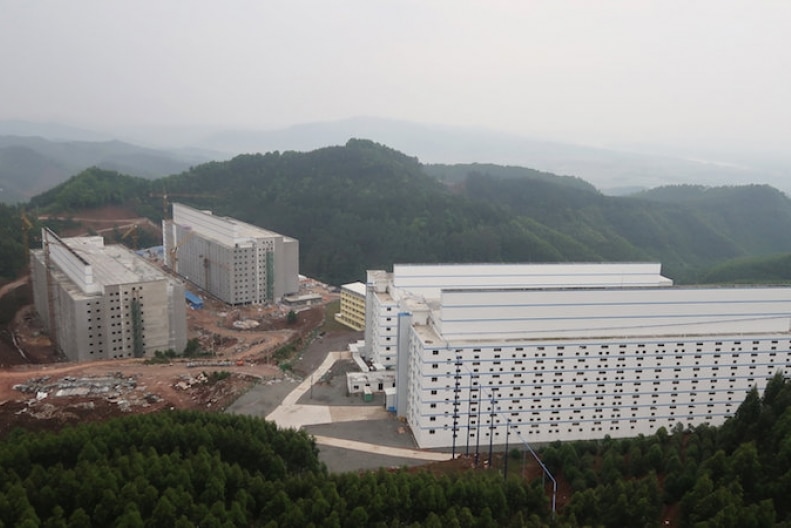 Apartment block-style pig farms in the mountains in China.