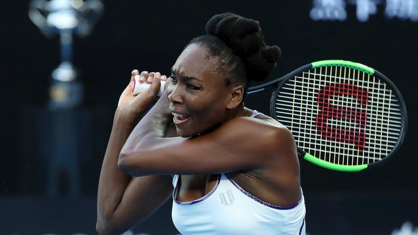 Venus Williams plays a backhand in Australian Open final