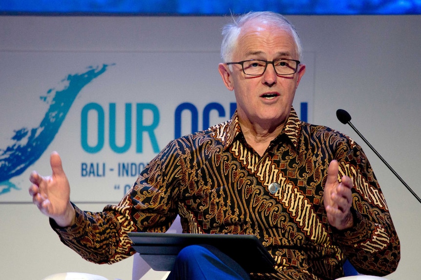 Australia's former prime minister Malcolm Turnbull wears a batik shirt while giving a speech during a conference in Bali.