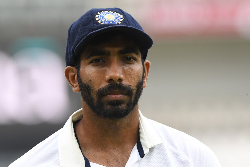 An Indian cricketer looks on despondently. 