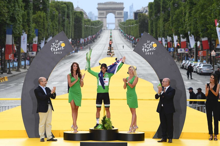 Michael Matthews celebrates on the Tour de France podium with green jersey