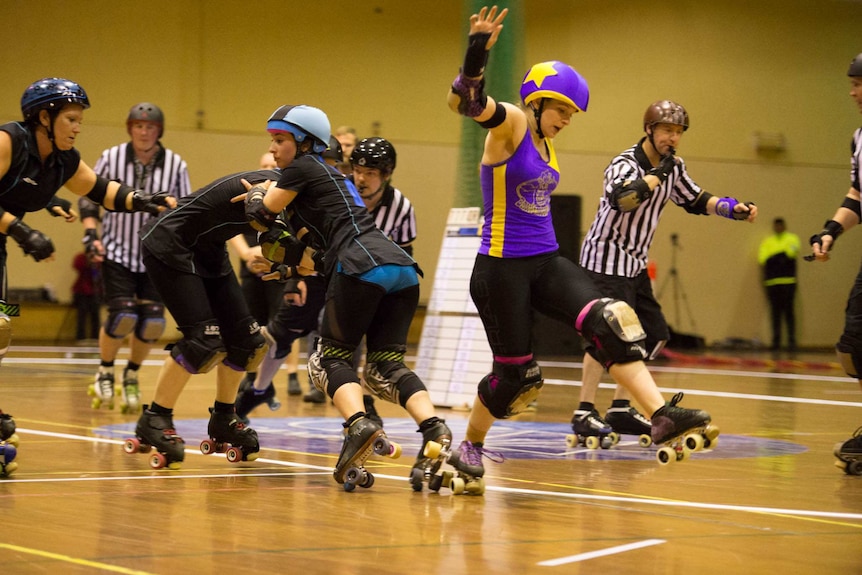 Group photo of a Canberra Roller Derby bout.