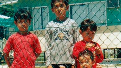 Children behind a fence in Nauru (AAP: Rural Australians for Refugees)