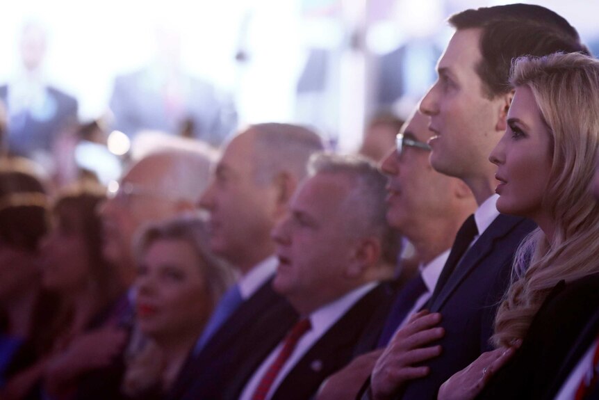 Jared Kushner and Ivanka Trump stand near Israeli PM Benjamin Netanyahu during the US national anthem.