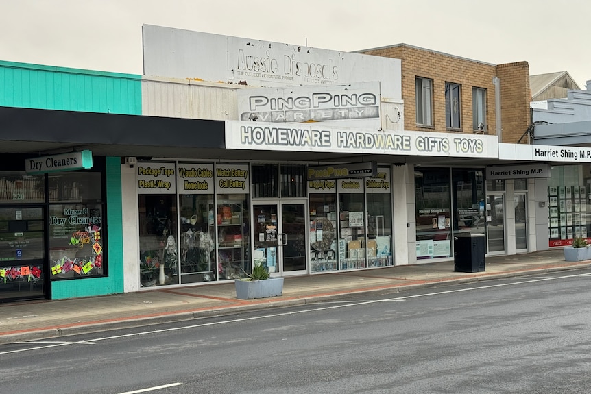 Ping ping shop front with dilapidated signage