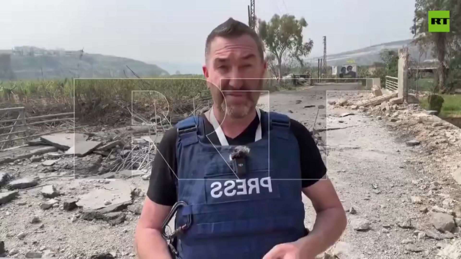 A man standing with a protective PRESS vest