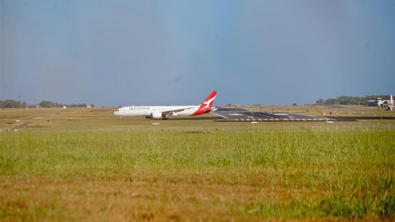 A plane touches down on a runway