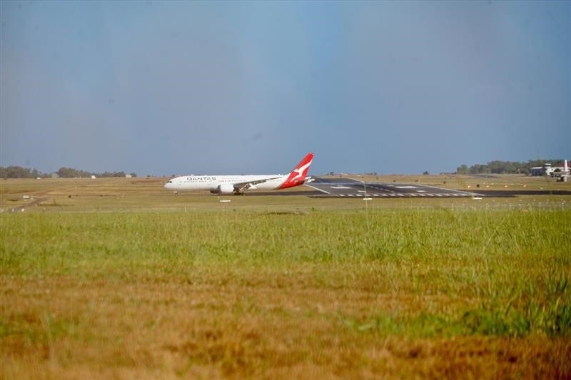 A plane touches down on a runway