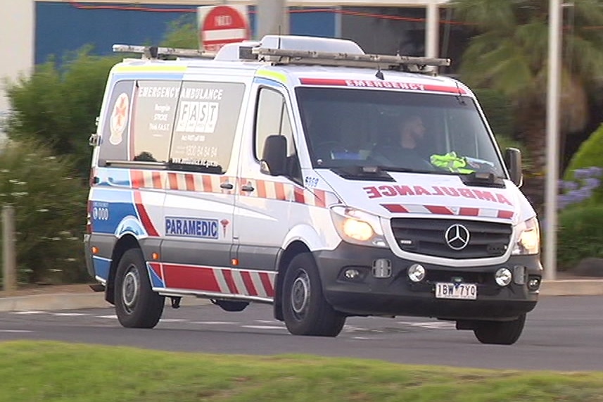 An ambulance drives away from Port Phillip Prison.
