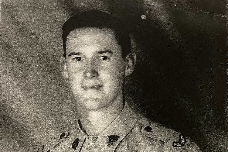 Old black and white photo of a man wearing an Australian army uniform, taken in the 1940s.