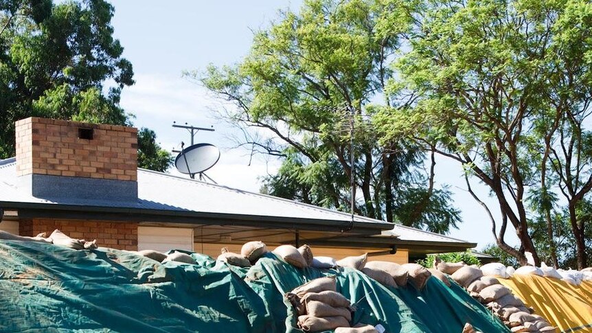 Sandbags surround a house in the south-west Queensland town of St George.