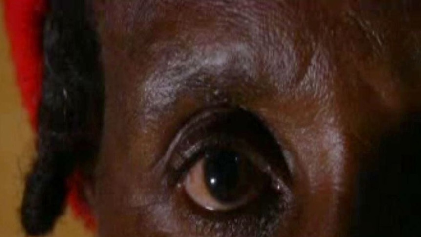 Close up of the face of an eldery Kenyan who works in the sex industry
