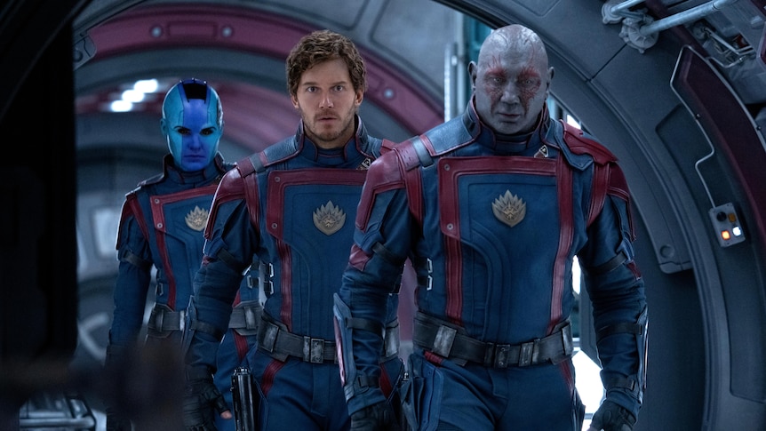 A scene from Guardians of the Galaxy shows three characters on a spaceship, walking as though they are on a mission.
