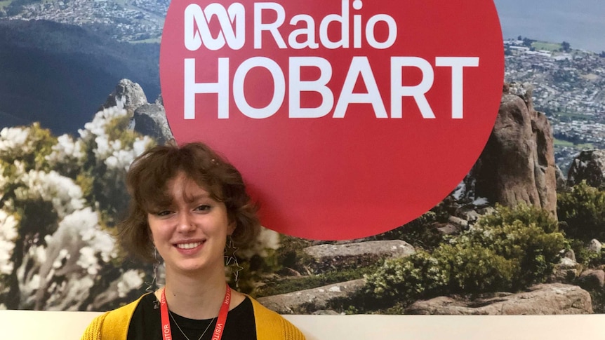 Elsa Beinssen-Henry, 16 year old student standing in front of ABC Radio Hobart sign