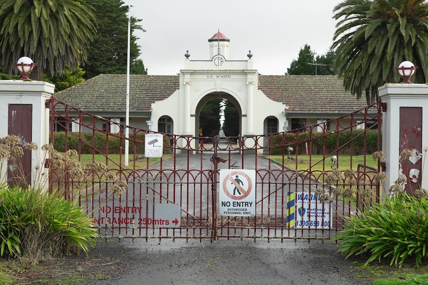 A 'no entry' sign can be seen at the entrance of the locked gates of Fiskville Training College