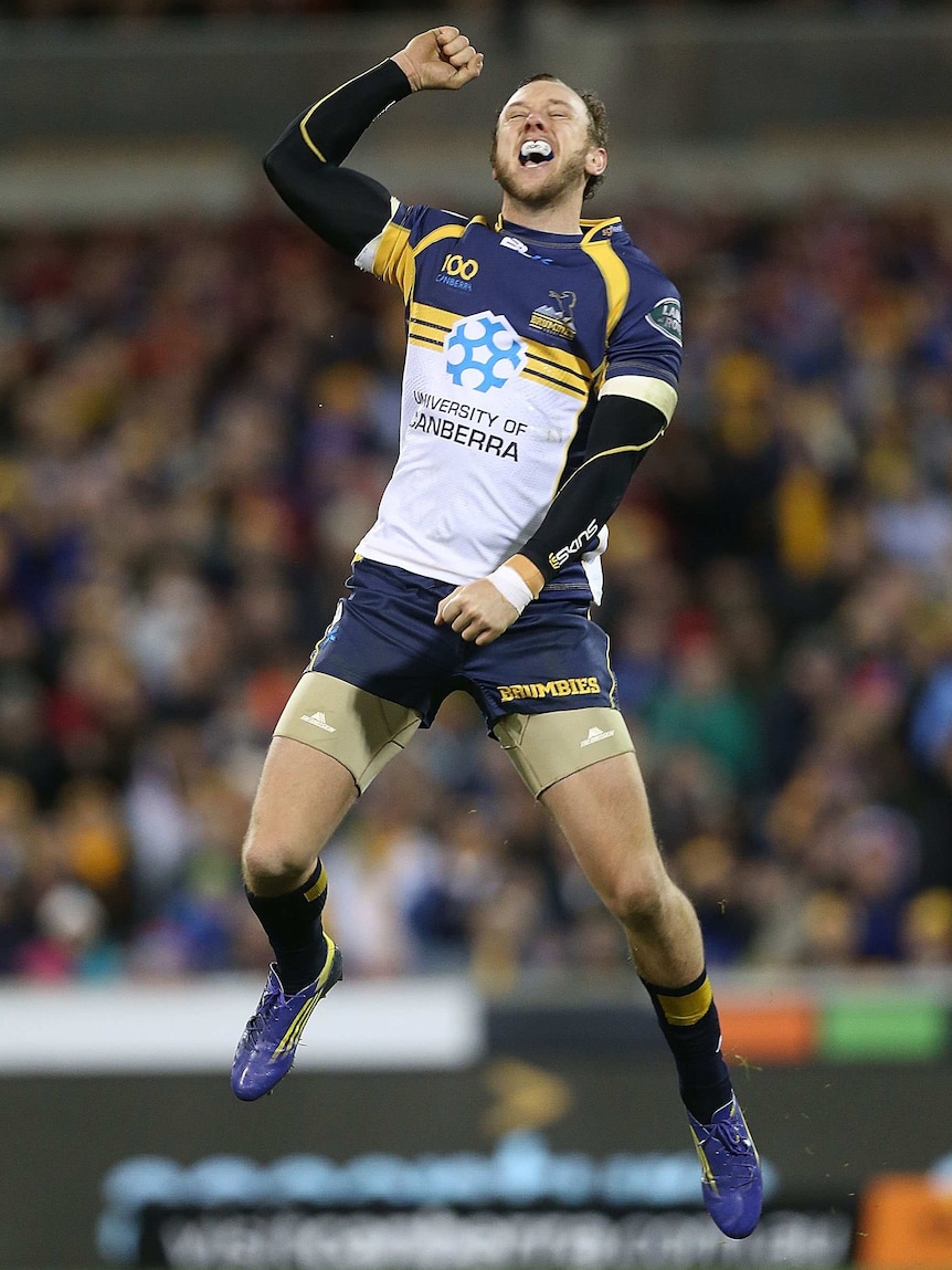 Historic moment ... Jesse Mogg celebrates the Brumbies' victory