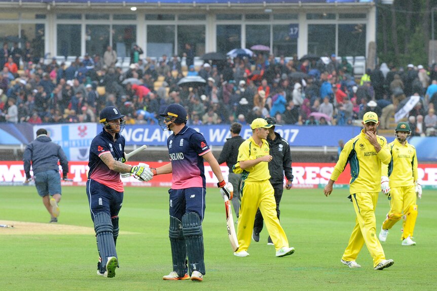 England and Australia players leave the field as rain interrupts play in Champions Trophy at Edgbaston