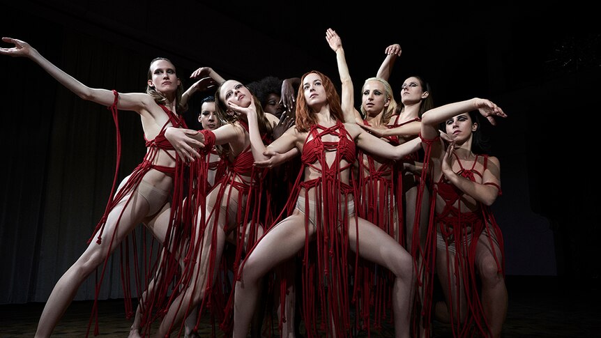 Colour still of a group of dancers in 2018 film Suspiria.