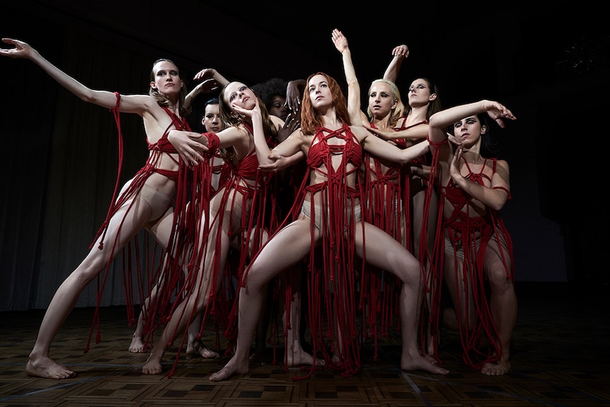 Colour still of a group of dancers in 2018 film Suspiria.