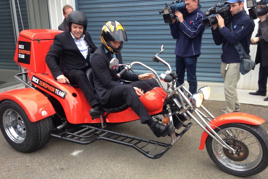 Nick Xenophon on a bike