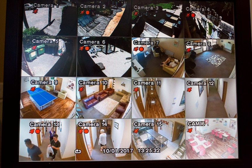Sixteen CCTV images are displayed in a grid on a screen.