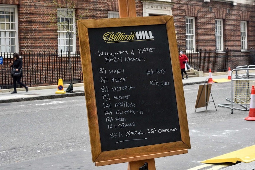 A chalkboard with the odds for the name of the third royal baby written on them.