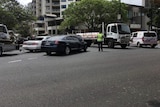 Police officers stop traffic on Coronation Drive amid reports of an active shooter.
