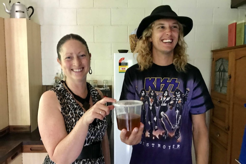 Vicki Arthur holds a tub of honey as Kyle Stiller laughs.