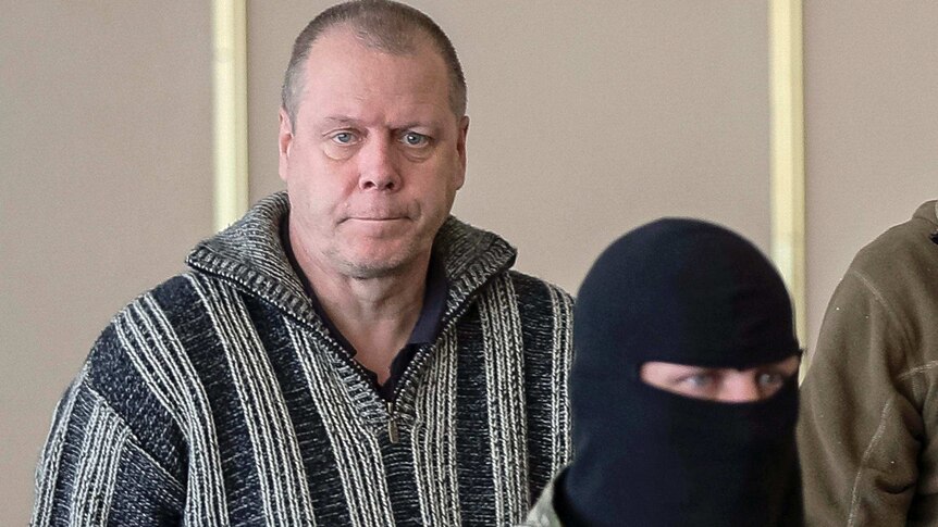 A detained Swedish international observer arrives for a meeting with journalists in the mayor's office in Slaviansk.