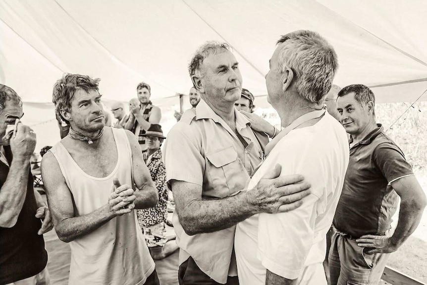 Black and White photo of men in tent from Men With Heart exhibition Hobart.