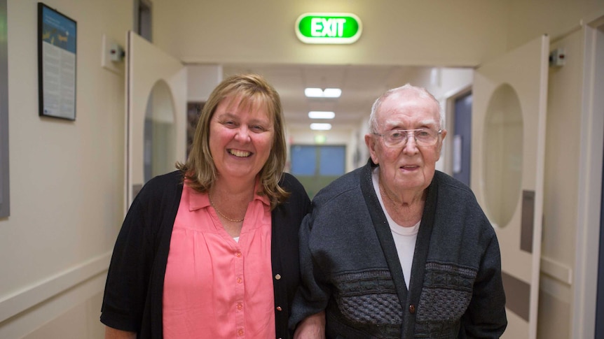 Roy's walks down the corridor with his daughter.