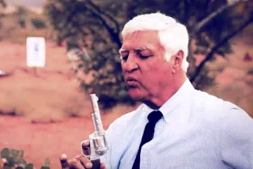 Bob Katter blows onto a smoking pistol.