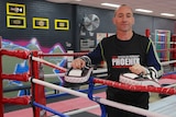 Pheonix Gym owner Anthony Manning standing in boxing ring.