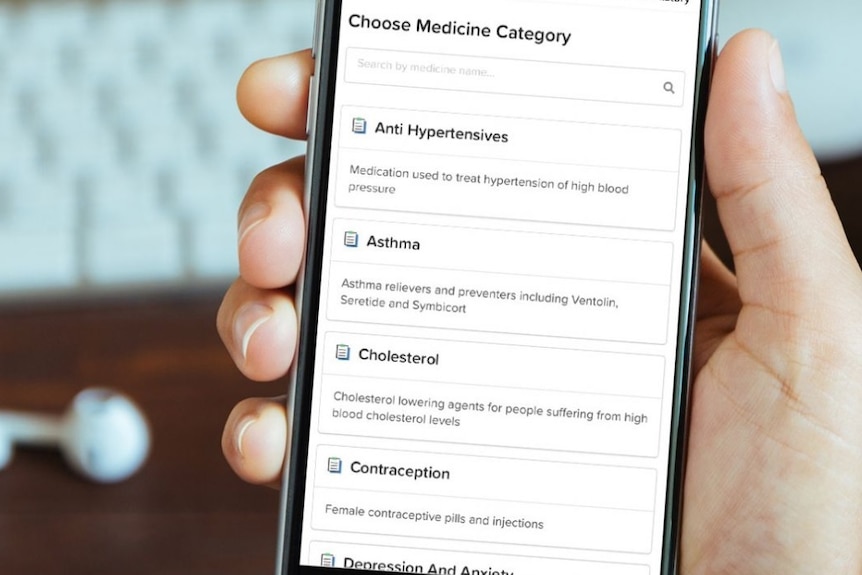 A hand holding a mobile phone offering online medical prescriptions
