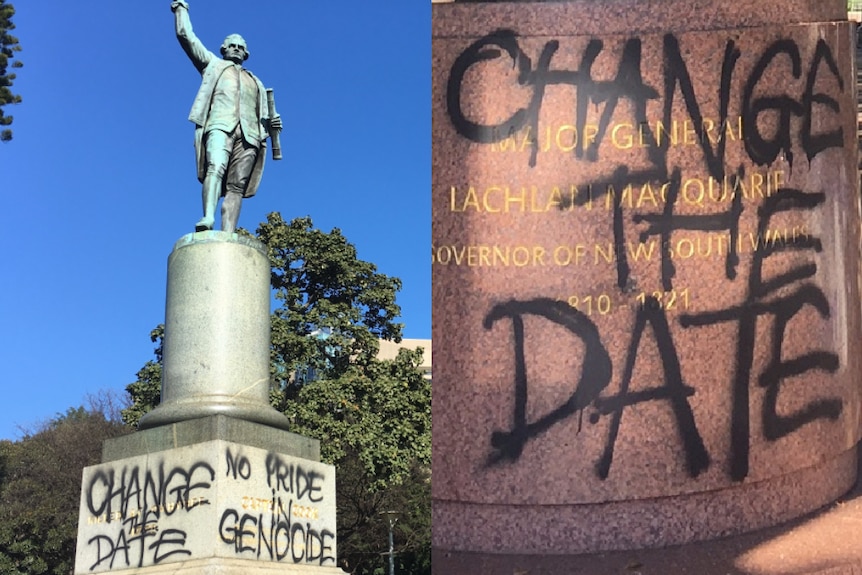 Two statues, with black paint on them.