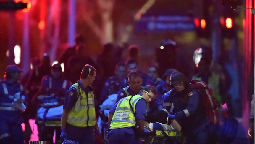 Paramedics with injured hostages at Martin Place