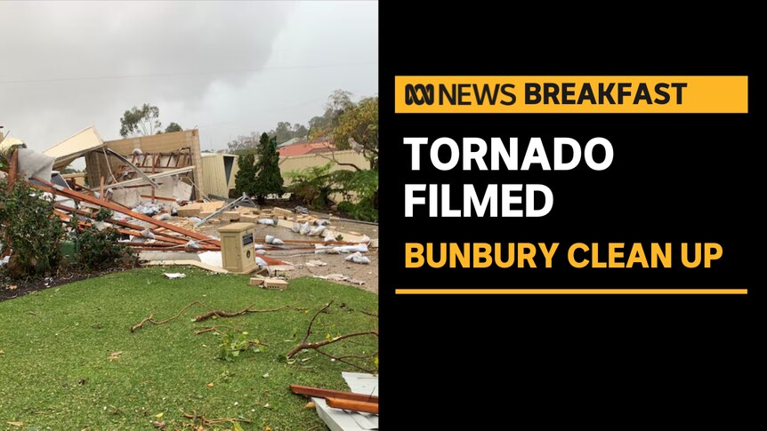 Tornado Filmed, Bunbury Clean Up: Construction and housing debris scattered on lawn.