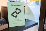 Afterpay sign with logo on counter