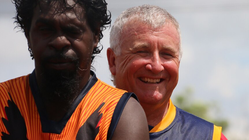 NT Police Sergeant Scott Rose, with a fellow Crows player.